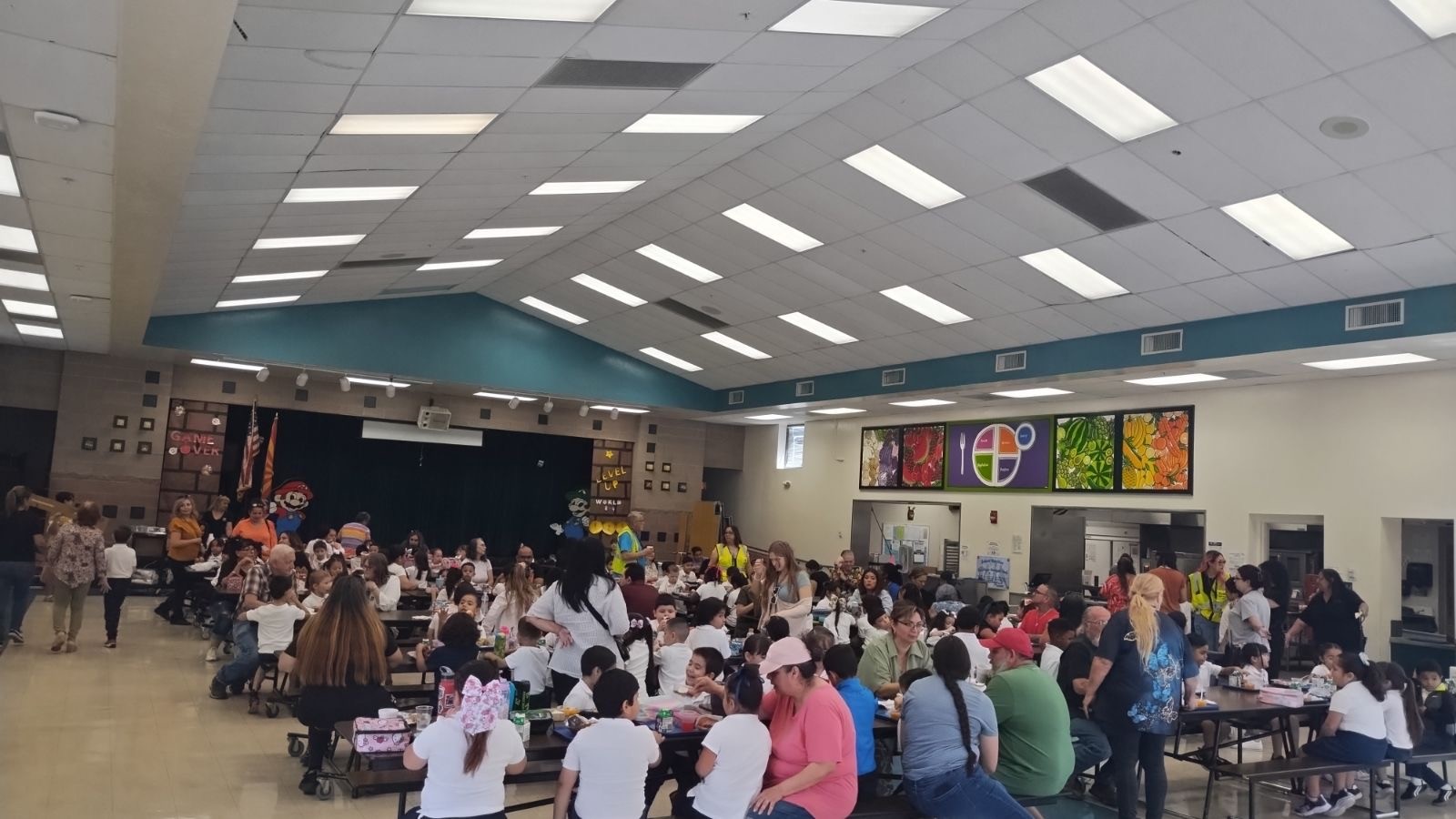 Families gather in the cafeteria for Grandparents Day celebrations