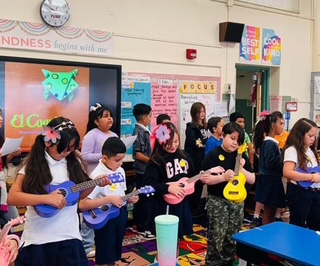 Students play colorful ukeleles